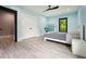 Bright bedroom with a modern ceiling fan, two windows, large closet, and minimalist decor at 2804 Skyland Ne Dr, Brookhaven, GA 30341