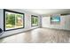 Bonus room featuring luxury vinyl flooring, built-in storage, a Murphy bed, and bright natural light at 2804 Skyland Ne Dr, Brookhaven, GA 30341
