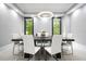 Bright dining room featuring a modern chandelier and large windows with views of the trees at 2804 Skyland Ne Dr, Brookhaven, GA 30341