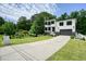 Beautiful two-story white-brick home on a manicured lot, featuring a two-car garage and a lengthy driveway at 2804 Skyland Ne Dr, Brookhaven, GA 30341