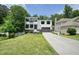 Attractive two-story home with a two-car garage, brick facade, professional landscaping, and concrete driveway at 2804 Skyland Ne Dr, Brookhaven, GA 30341