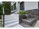 Stylish entrance featuring modern railings, stone accents, and a serene water feature, adding curb appeal at 2804 Skyland Ne Dr, Brookhaven, GA 30341