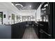 Modern kitchen with sleek black cabinets, black appliances, and open layout at 2804 Skyland Ne Dr, Brookhaven, GA 30341
