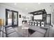 Open floor plan showcasing living room with sectional, wet bar, and pool table at 2804 Skyland Ne Dr, Brookhaven, GA 30341