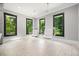 Bright living room with suspended bubble chairs and large windows providing abundant natural light at 2804 Skyland Ne Dr, Brookhaven, GA 30341