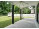 Covered patio with stained concrete flooring, ceiling fan, and backyard views at 2804 Skyland Ne Dr, Brookhaven, GA 30341
