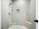 Luxurious glass-enclosed shower featuring elegant tile work and sleek fixtures at 2804 Skyland Ne Dr, Brookhaven, GA 30341