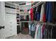 Large walk-in closet featuring custom shelving and hanging rods for organized storage and convenience at 2804 Skyland Ne Dr, Brookhaven, GA 30341