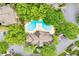 Aerial view of the community pool and clubhouse surrounded by lush trees and parking lots at 539 Mcgill Park Ne Ave, Atlanta, GA 30312