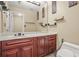 Bright bathroom featuring a wood vanity, marble countertop, decorative wall art, and a large mirror at 539 Mcgill Park Ne Ave, Atlanta, GA 30312
