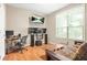 This bedroom features a large window, hardwood floors, and an entertainment center with speakers at 539 Mcgill Park Ne Ave, Atlanta, GA 30312