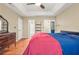 Bedroom featuring hardwood floors, natural lighting, a ceiling fan and a dresser at 539 Mcgill Park Ne Ave, Atlanta, GA 30312