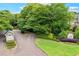 A warm welcome: Gated entrance to McGill Park with mature landscaping and a guard house at 539 Mcgill Park Ne Ave, Atlanta, GA 30312