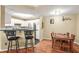 Bright kitchen with stainless steel appliances and bar seating, next to dining area at 539 Mcgill Park Ne Ave, Atlanta, GA 30312