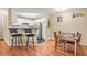 Bright kitchen with stainless steel appliances and bar seating, next to dining area at 539 Mcgill Park Ne Ave, Atlanta, GA 30312