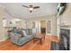 Cozy living room features a fireplace, ceiling fan, and open floor plan at 539 Mcgill Park Ne Ave, Atlanta, GA 30312