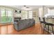 Open-concept living room boasts a fireplace, wood floors, and large windows for plenty of natural light at 539 Mcgill Park Ne Ave, Atlanta, GA 30312