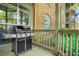 View of a brick patio with a grill, overlooking a green area in a residential building at 539 Mcgill Park Ne Ave, Atlanta, GA 30312