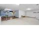Partially finished basement with concrete and wood flooring, offering potential for various uses at 6960 Worley Rd, Cumming, GA 30028
