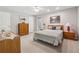 Spacious bedroom featuring a ceiling fan and ample natural light at 6960 Worley Rd, Cumming, GA 30028