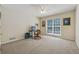 Bright bedroom with a large window, ample space for a home office, and comfortable living at 6960 Worley Rd, Cumming, GA 30028
