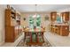 Inviting dining room with a large table, seating for eight, and doors leading to a spacious outdoor deck at 6960 Worley Rd, Cumming, GA 30028