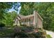 Single-story home features verdant lawn, professional landscaping, and an attached two-car garage at 6960 Worley Rd, Cumming, GA 30028