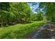 Beautiful property with lush green lawns and mature trees at 6960 Worley Rd, Cumming, GA 30028