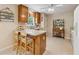 Efficient kitchen design with breakfast bar, essential appliances, and ample storage, perfect for everyday cooking at 6960 Worley Rd, Cumming, GA 30028