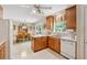 Charming eat-in kitchen offers ample counter space, essential appliances, and a seamless flow to the adjacent dining area at 6960 Worley Rd, Cumming, GA 30028