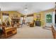 Cozy living room with brick fireplace, plush seating, and ample natural light, ideal for relaxation and entertaining at 6960 Worley Rd, Cumming, GA 30028