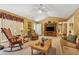 Spacious living room offers ample seating, a media center, and a view into the entryway at 6960 Worley Rd, Cumming, GA 30028