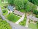 Expansive property featuring a well-manicured lawn, mature trees, and proximity to a golf course at 12162 Mountain Laurel Dr, Roswell, GA 30075