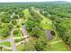 Gorgeous aerial view showing golf course, pond and luscious green landscaping at 12162 Mountain Laurel Dr, Roswell, GA 30075