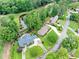 Beautiful home and manicured lawn on a golf course with nearby pond at 12162 Mountain Laurel Dr, Roswell, GA 30075