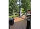 Spacious back deck with dining area, ideal for entertaining with scenic views of the yard at 12162 Mountain Laurel Dr, Roswell, GA 30075