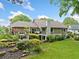 Spacious backyard featuring a multi-level deck, lush landscaping, and well-maintained lawn at 12162 Mountain Laurel Dr, Roswell, GA 30075