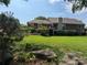 Expansive backyard with lush lawn, mature trees, and inviting patio areas for outdoor enjoyment at 12162 Mountain Laurel Dr, Roswell, GA 30075