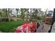 Beautiful backyard deck overlooking a pond and landscaped with vibrant azaleas at 12162 Mountain Laurel Dr, Roswell, GA 30075