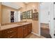 Bathroom features a wood vanity with marble countertop and decorative mirrors at 12162 Mountain Laurel Dr, Roswell, GA 30075