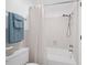 Cozy bathroom featuring a tub and shower with white tiles at 12162 Mountain Laurel Dr, Roswell, GA 30075