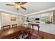 Open dining area with hardwood floors and a seamless connection to the living room at 12162 Mountain Laurel Dr, Roswell, GA 30075
