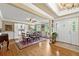 Elegant dining room featuring hardwood floors, natural light, and traditional decor at 12162 Mountain Laurel Dr, Roswell, GA 30075