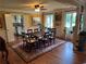 Elegant dining room featuring hardwood floors, large windows, and ample space for entertaining guests at 12162 Mountain Laurel Dr, Roswell, GA 30075