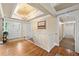 Elegant foyer with hardwood floors, chandelier, and staircase with white railings at 12162 Mountain Laurel Dr, Roswell, GA 30075
