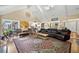 Inviting living room boasts hardwood floors, neutral colors, vaulted ceiling, and backyard view at 12162 Mountain Laurel Dr, Roswell, GA 30075