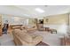 Spacious living room in basement with comfortable seating, fireplace and game area at 12162 Mountain Laurel Dr, Roswell, GA 30075