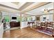 Open-concept living space featuring hardwood floors, tray ceilings, and natural light at 12162 Mountain Laurel Dr, Roswell, GA 30075