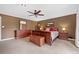 Spacious primary bedroom with a wooden chest, dresser, and warm tones at 12162 Mountain Laurel Dr, Roswell, GA 30075