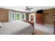 Spacious primary bedroom featuring carpet floors and backyard view at 12162 Mountain Laurel Dr, Roswell, GA 30075